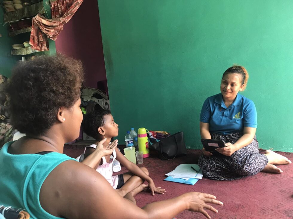 Unise Vakaloloma providing information to study participants before the survey