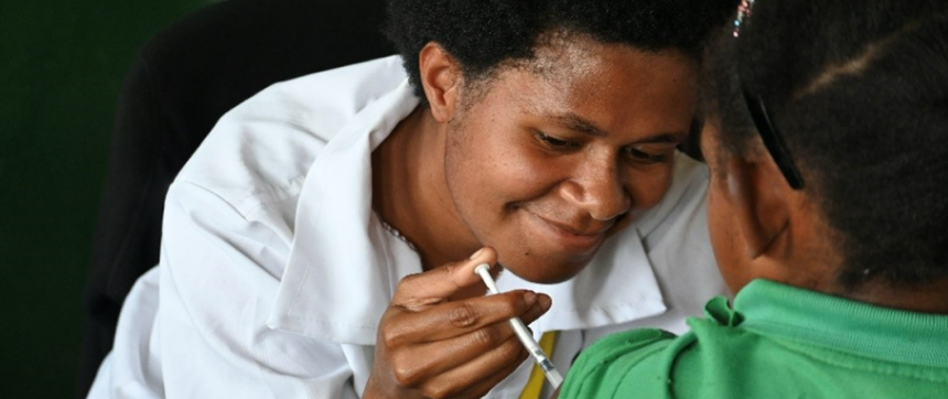A young PNG girl receiving a vaccination..